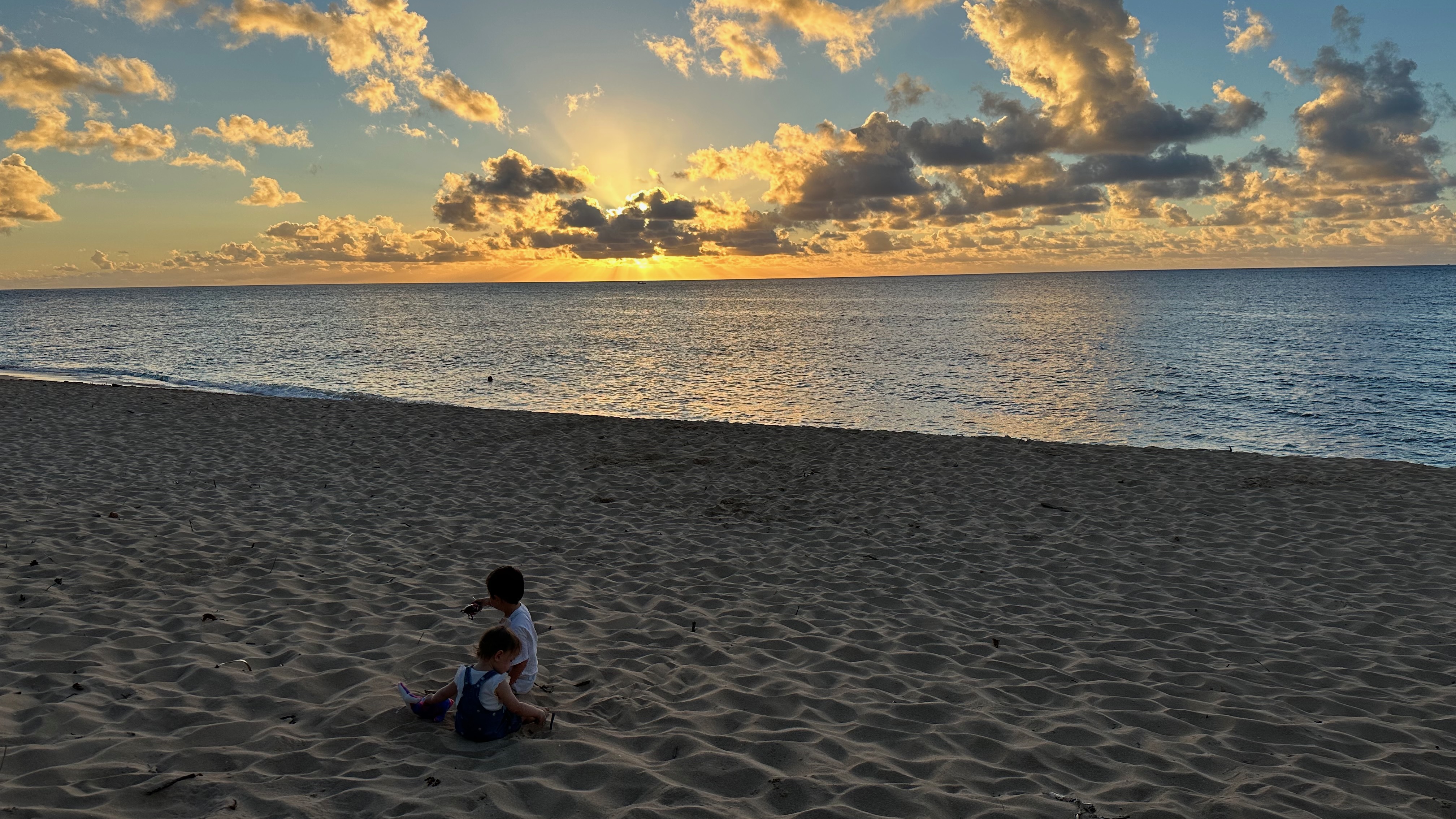 My family when on a beach walk behind the house, toward Haleiwa.
